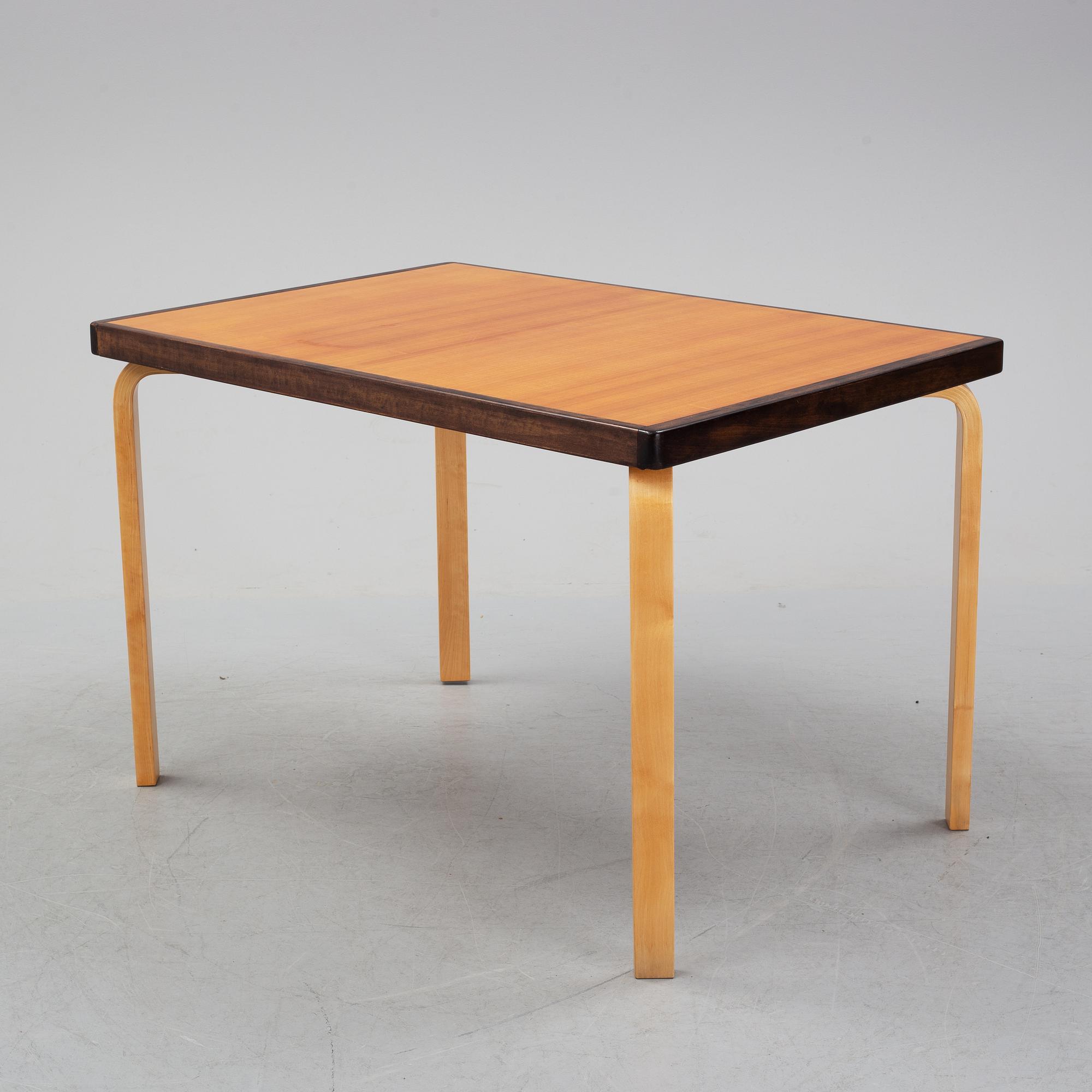 Alvar Aalto, a teak dining table, Artek, Finland, mid 20th Century.