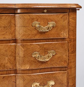 A late Baroque walnut-veneered chest of drawers attributed to J. H. Fürloh (master in Stockholm 1724-1745).