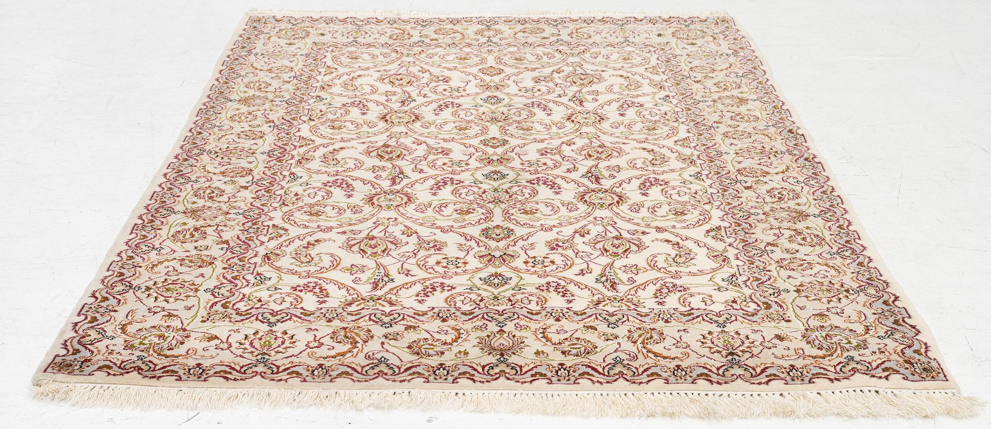 An Isfahan part silk rug, c. 161 x 110 cm.