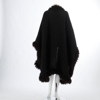 YVES SAINT LAURENT, a black wool and brown fur trimmed cape.