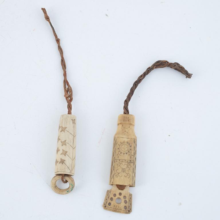 Two needle cases, one dated 1936.