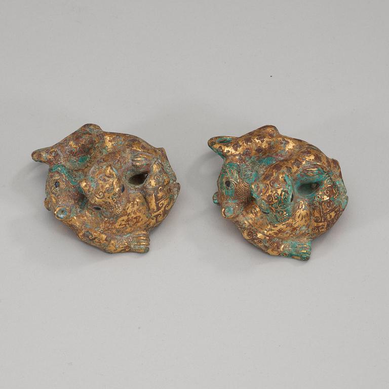 Two archaistic bronze weights, China.