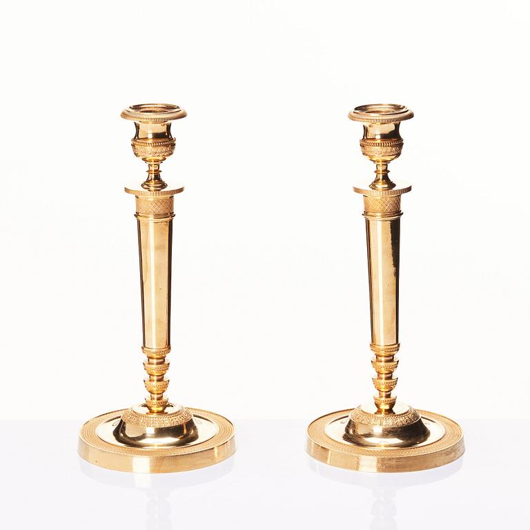 A pair of French Empire candlesticks, early 19th century.