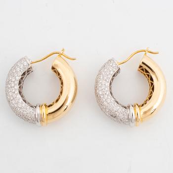 Gold and brilliant-cut diamond hoop earrings.