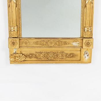 An Empire mirror, first half of the 19th Century.