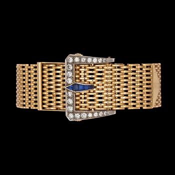 969. A gold bracelet with diamond and blue sapphire clasp.
