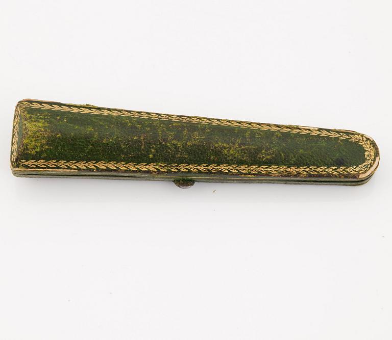 A 1920's cigarette holder of tortoiseshell and meerschaum decorated with rose-cut diamonds.