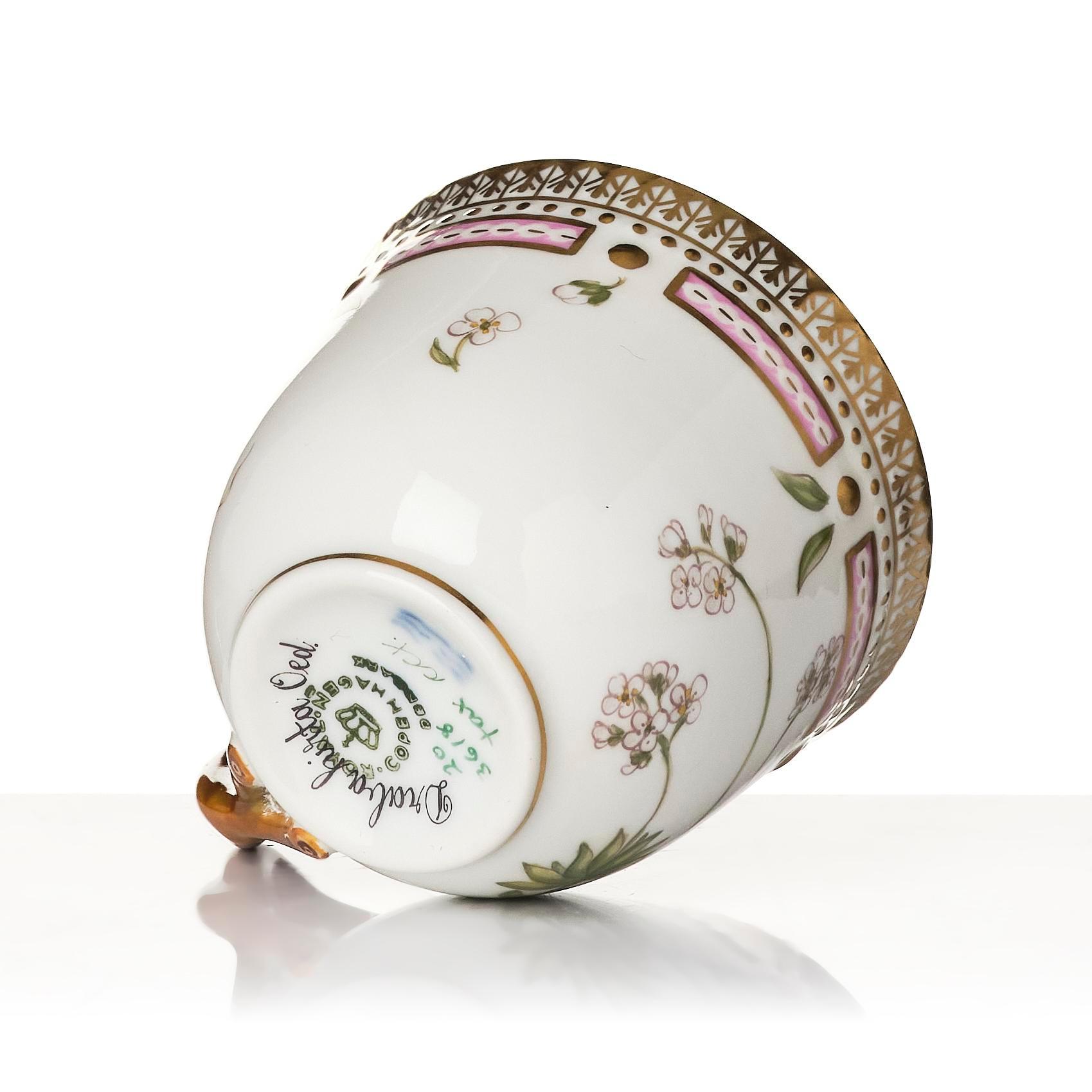 A set of nine Royal Copenhagen 'Flora Danica' cups with saucers, Denmark, 20th century.