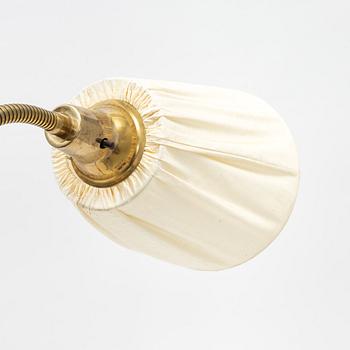 A brass and teak floor light, 1950's.