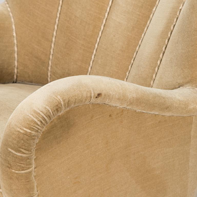 A pair of mid-20th century armchairs.