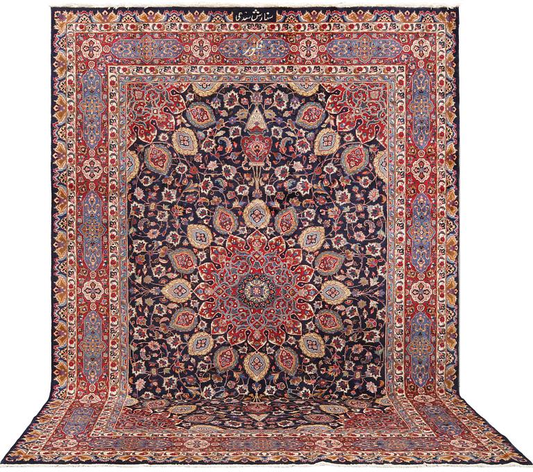 A Kashmar carpet from eastern Iran of 'Ardabil' design, signed, c 338 x 245 cm.