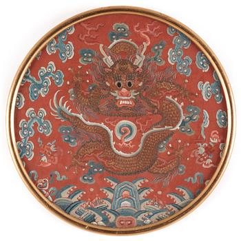 1205. An embroidered dragon roundel from the surcoat of an Emperor or Imperial son, Qing dynasty, 19th century.