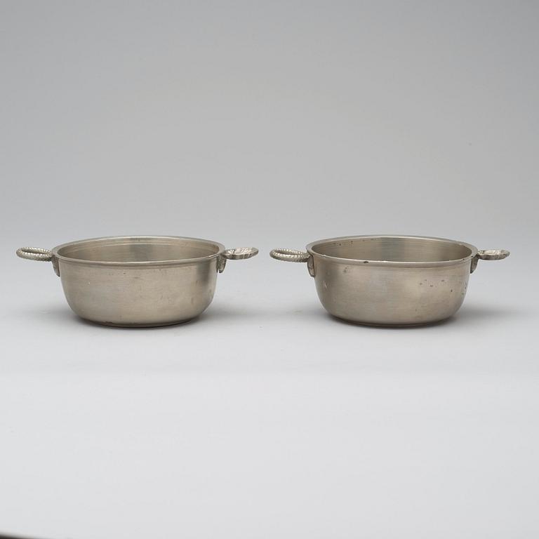 A pair of pewter food holders by M Leffler 1841.