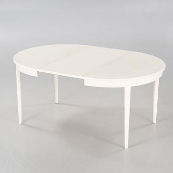 A dining table named "Herrgården", designed by Carl Malmsten.