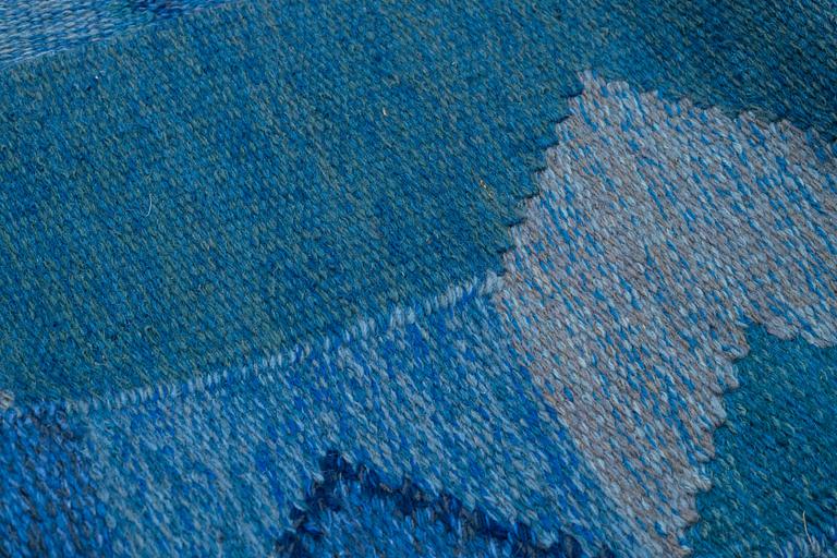 Brita Grahn, a carpet, "Blåvinge", flat weave, ca 282 x 202,5 cm, signed Brita Grahn.