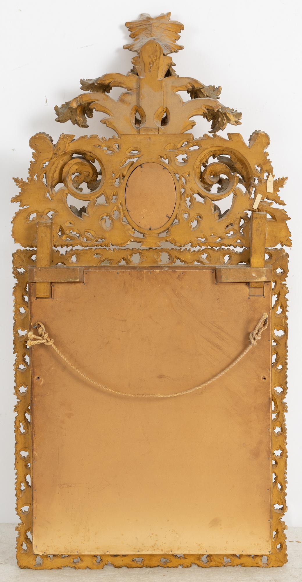 A 20th century Baroque style mirror.