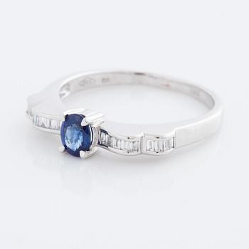 A sapphire and baguette cut diamond ring.