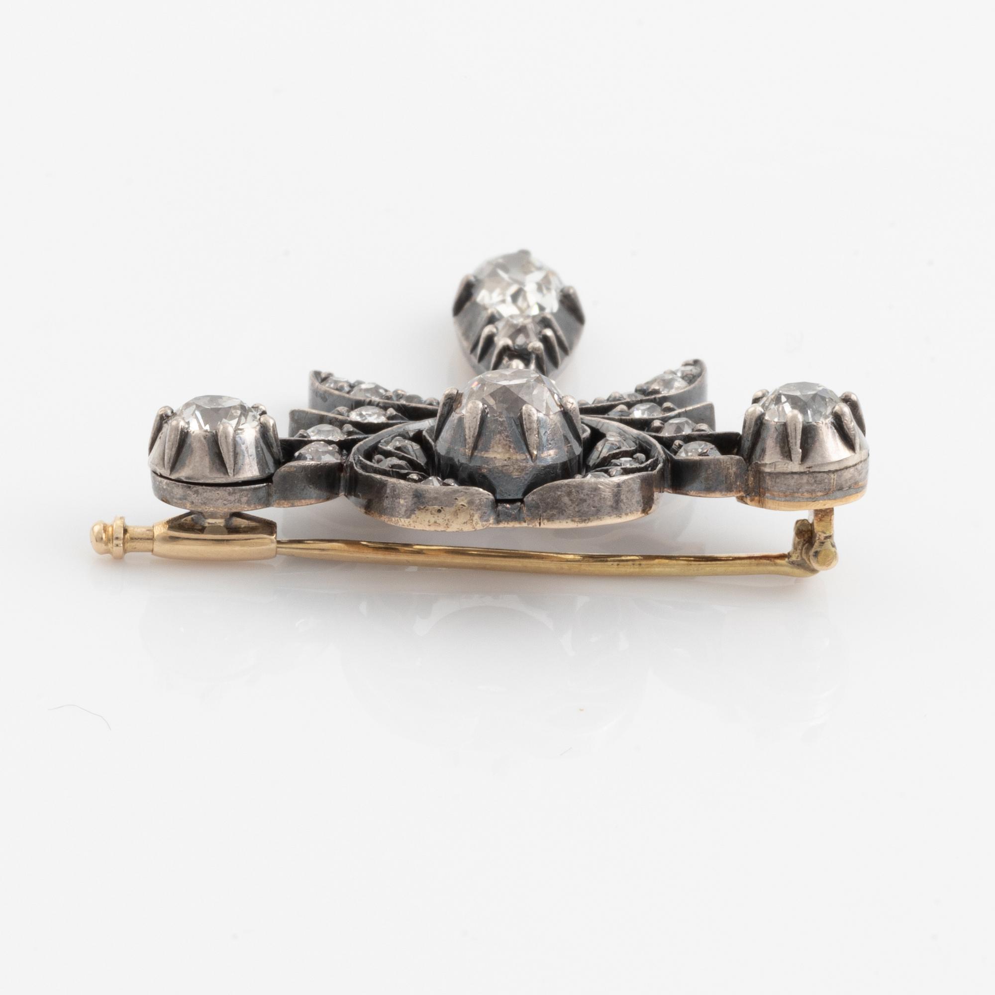 A silver and gold brooch set with old-cut diamonds, in a fitted case from JE Torsk.