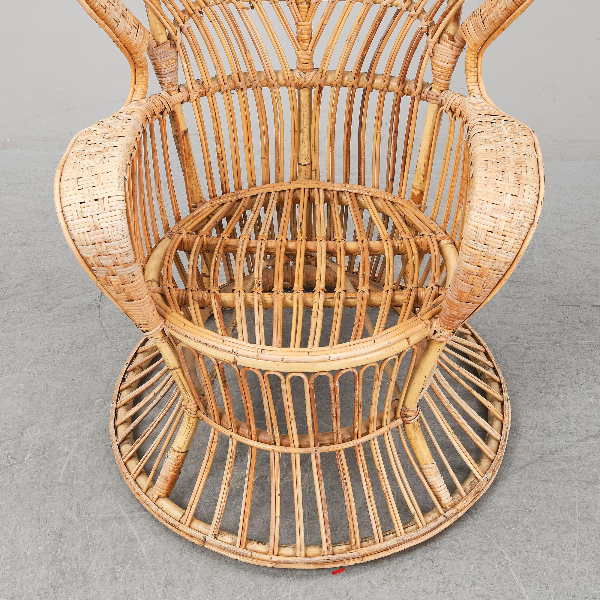 GIO PONTI & LIO CARMINATI, A 'Conte Biancamano' rattan Wingback Armchair for Bonacina, Italy.