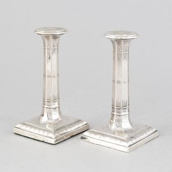 A pair of silver candlesticks, mark of Thomas Bradbury & Sons Ltd, Sheffield 1918.