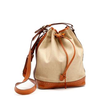 CÉLINE, a leather and canvas shoulder bag.