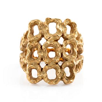 A Gilbert Albert ring in 18K gold.