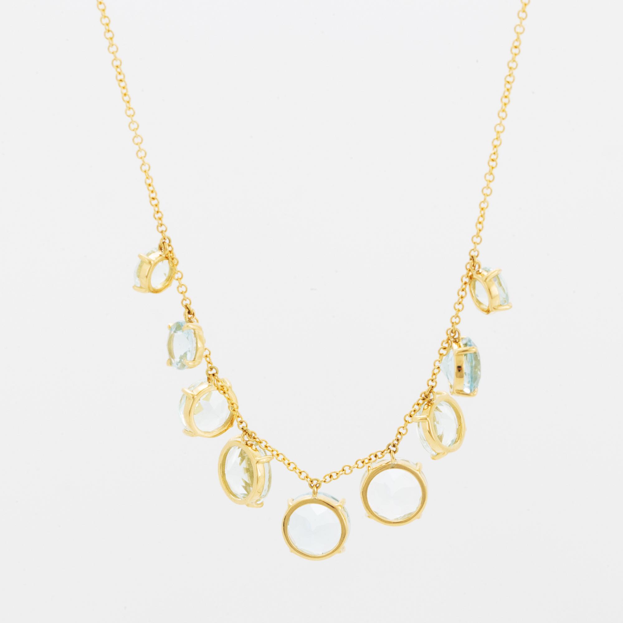 Collier, med runda fasettslipade akvamariner.
