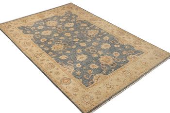 An Ushak rug, c. 242 x 165 cm.