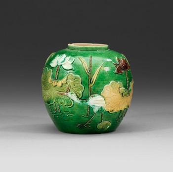 A green, aubergine and yellow glazed bisquit jar, Qing dynasty, 19th Century.