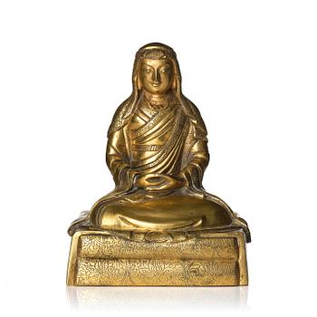 1054. A gilt bronze sculpture of Arhat Ajita, Tibeto-Chinese, 18th century.