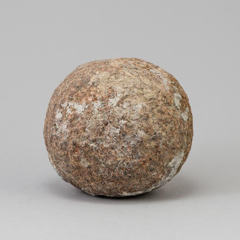 A GRANITE CANNON BALL, possibly 18th century.