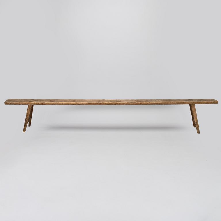 A folk art bench, circa 1900.
