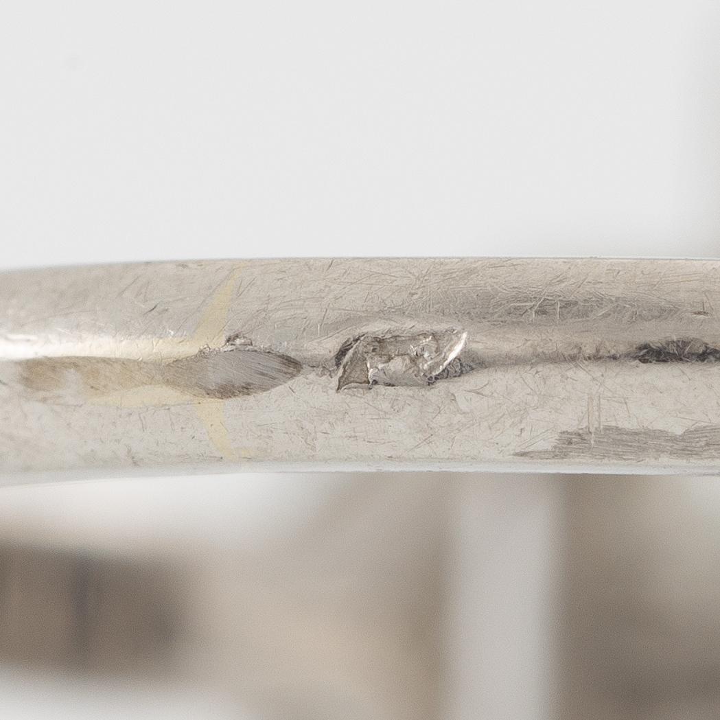 Platinum ring with sapphire and old-cut diamonds.