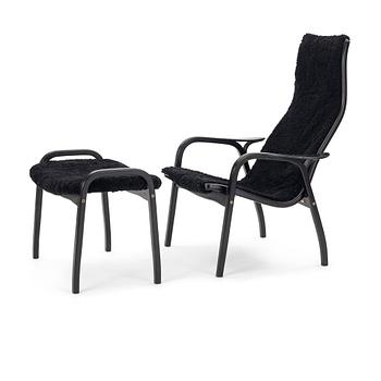 99. Yngve Ekström, A black "Lamino", easy chair with ottoman, Swedese, Sweden 21st Century.