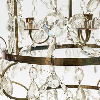 A three-light Gustavian-style hanging light, circa 1900.