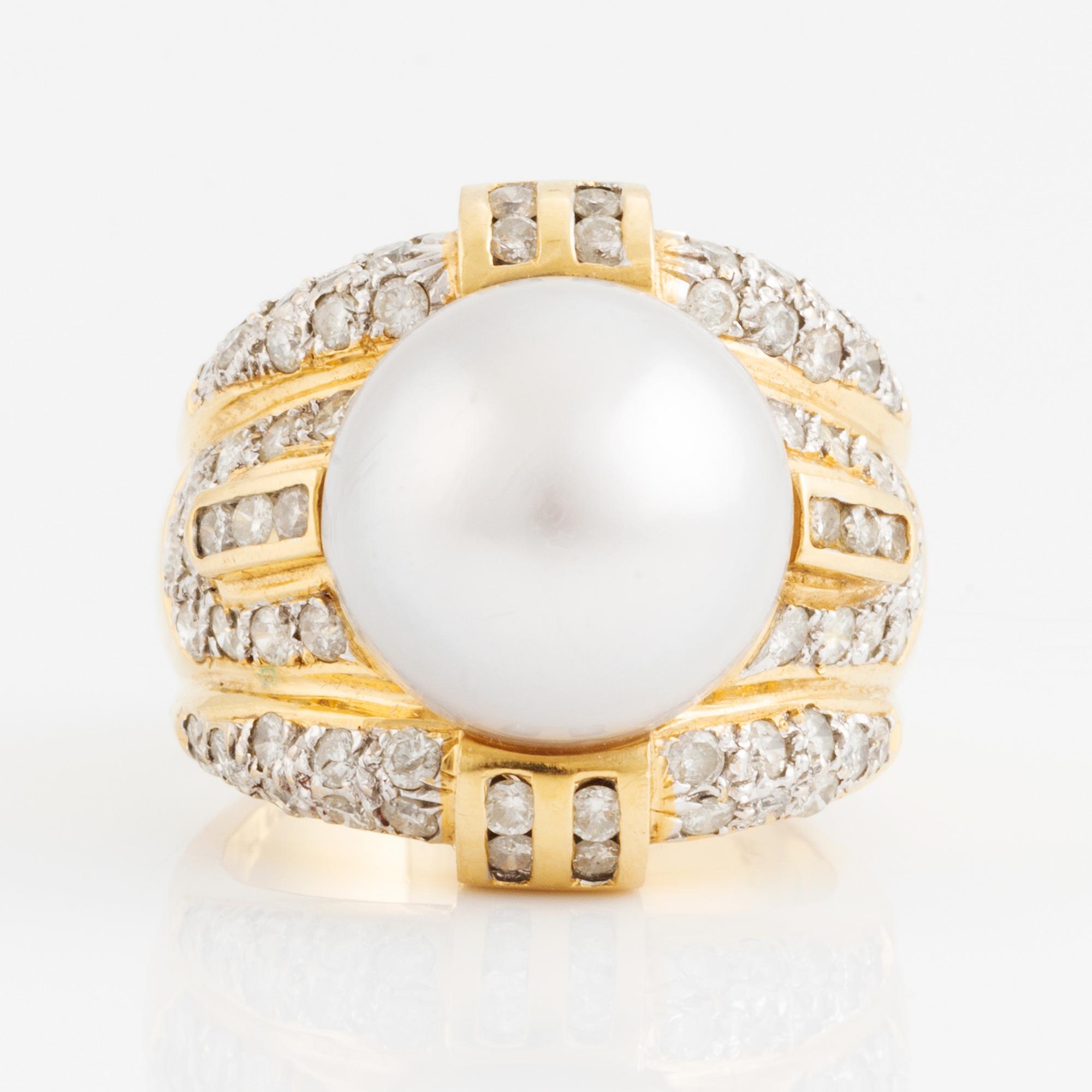 Cultured pearl and brilliant cut diamond ring.