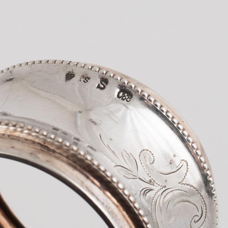 A set of five silver napkin rings, including Russia, circa 1900.