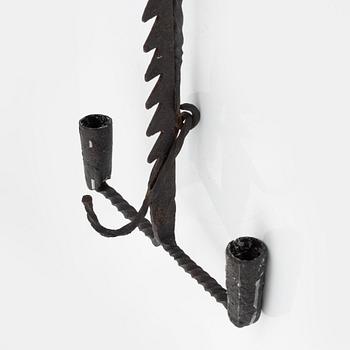 A wrought-iron two-light candlestick, 19th/20th Century.