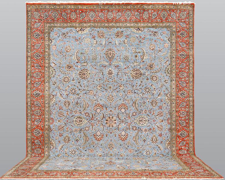 A Ghom carpet, part silk, approx. 480 x 350 cm.