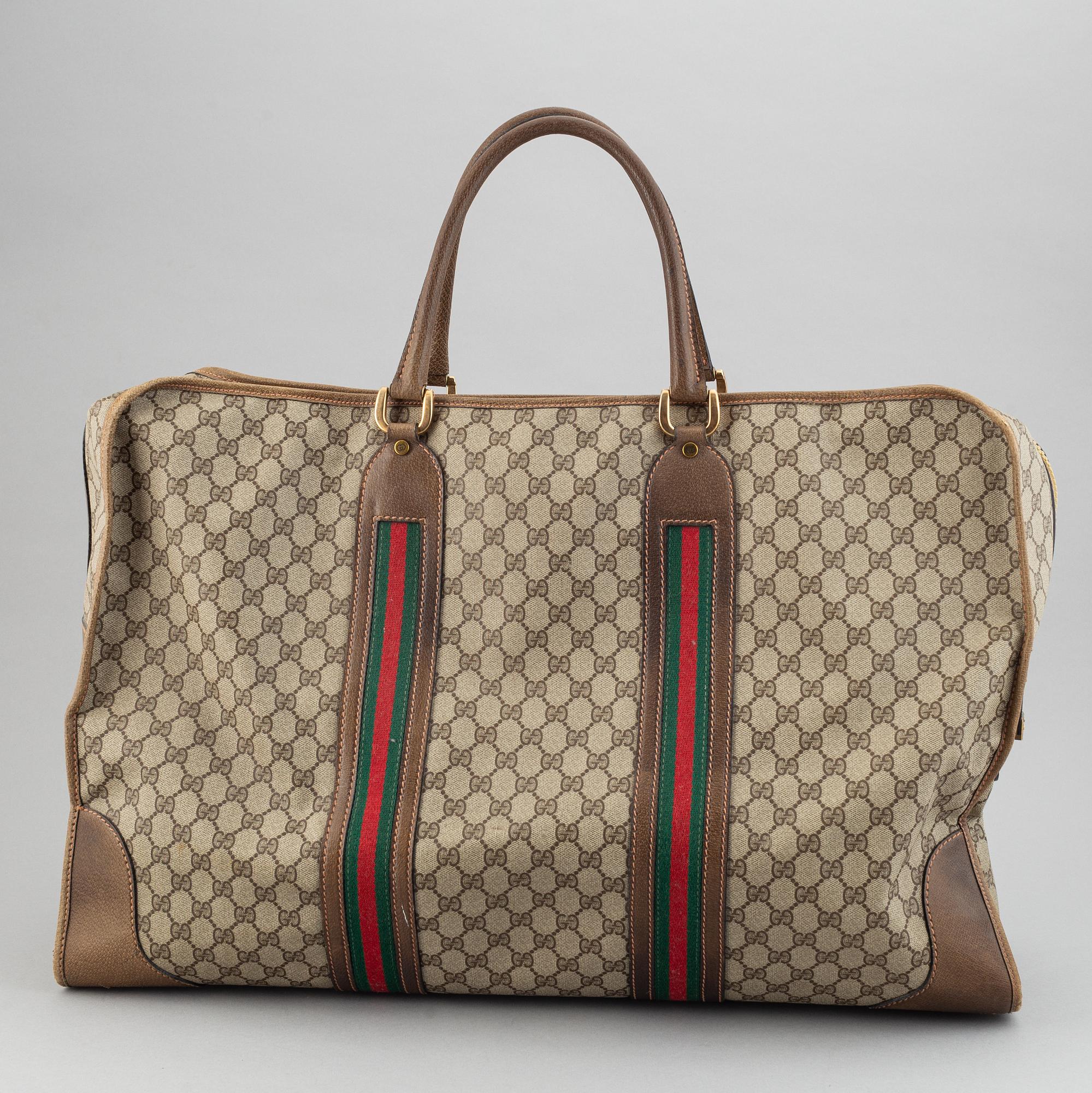 Gucci, a canvas weekend bag.