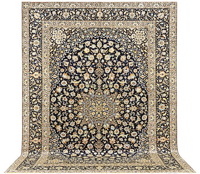 A Kashan carpet, a. 422 x 306 cm.