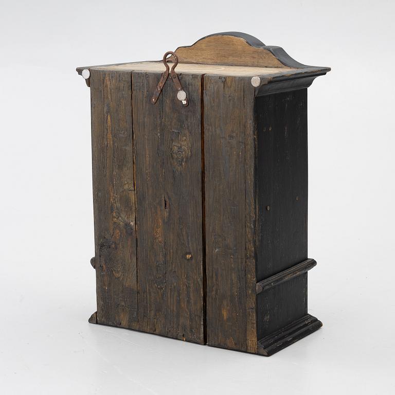 A Baroque wall cabinet, 18th Century.