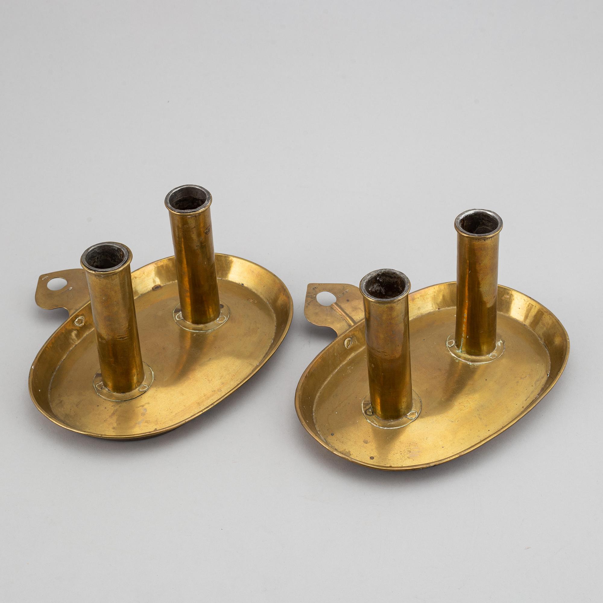 A pair of North European Brass double candelholders, 19th century.