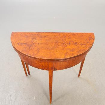 A birch late 19th century game table.