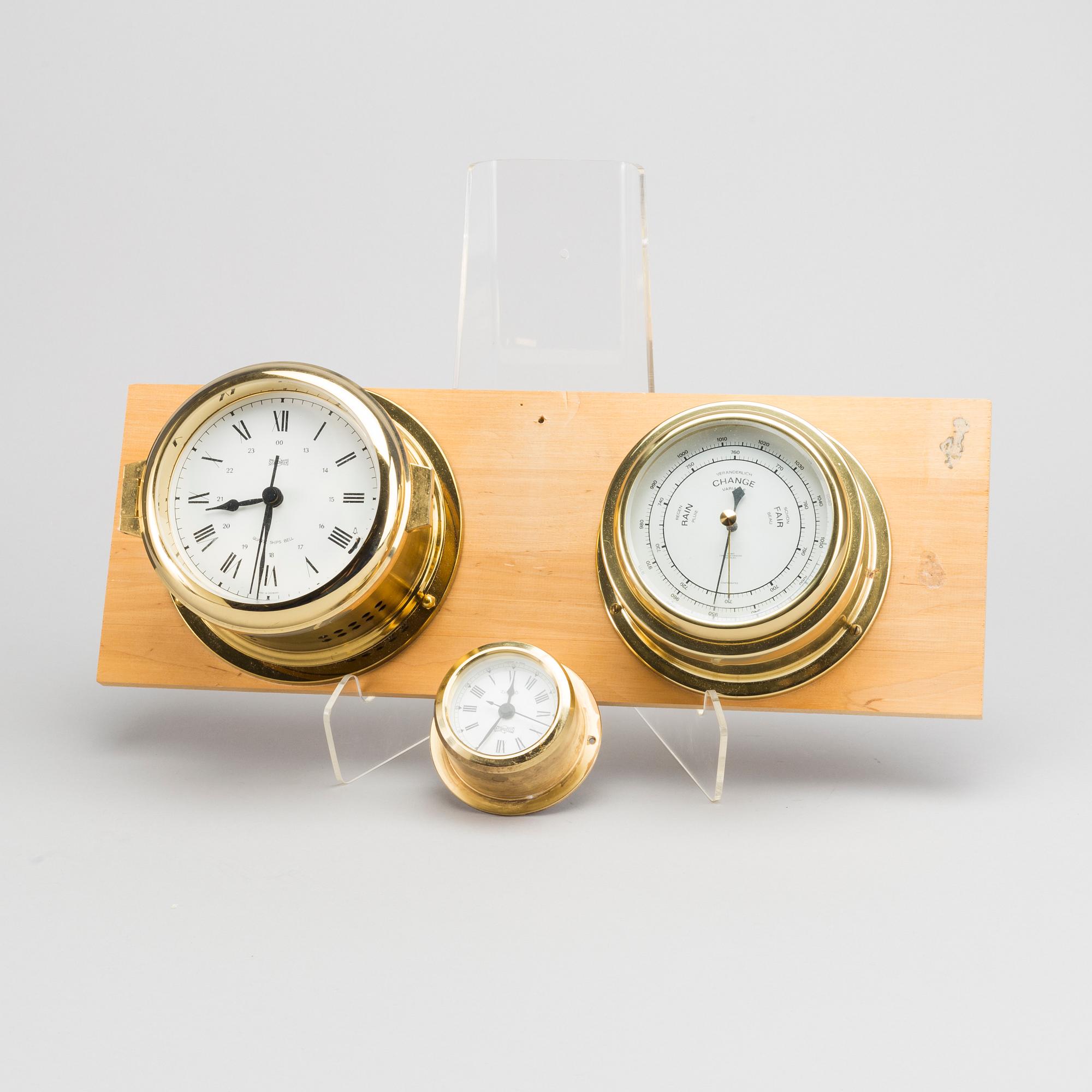 TWO BRASS MARINE CLOCK AND A BAROMETER BY STOCKBURGER.