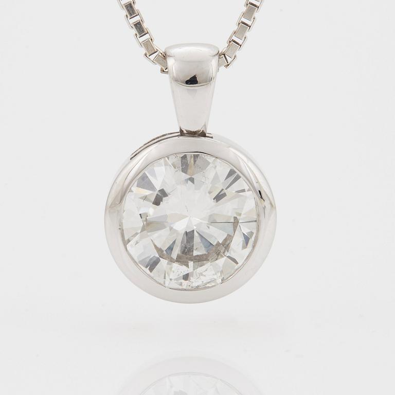 A PENDANT set with a round brilliant-cut diamond.