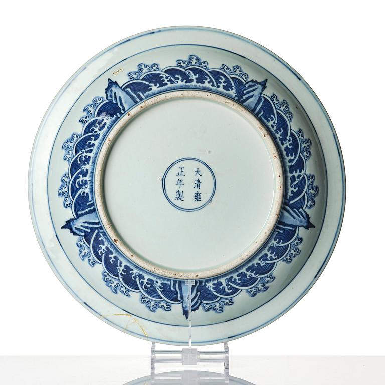 A large blue and white 'dragon' charger, late Qing dynasty/Republic with an apocryphal Yongzheng mark.