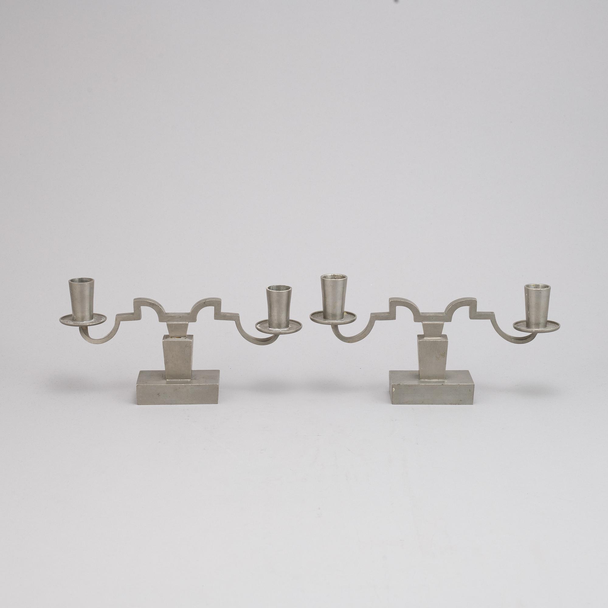 Nils Fougstedt, A pair of pewter candle sticks for Firma Svenskt Tenn, 1933.