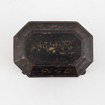 A Chinese lacquered tea caddy with pewter inserts, Qing dynasty, 19th century.