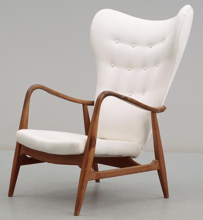 A Danish upholstered wing-back armchair, 1940-50's,